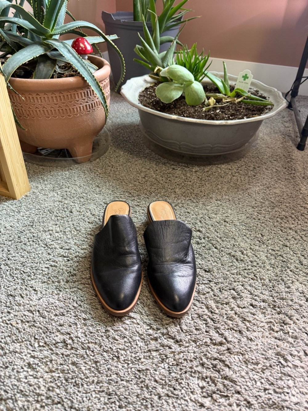 Crown Vintage Black Slip-On Flats with Brown Soles.